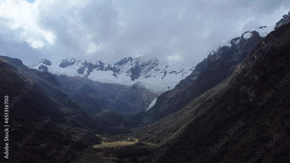 Nevado Mateo mountain peaks wiith glaciers from a distance on a cloudy day Aerial Video Nevado Mateo mountain peaks wiith glaciers from a distance on a cloudy day Aerial Video