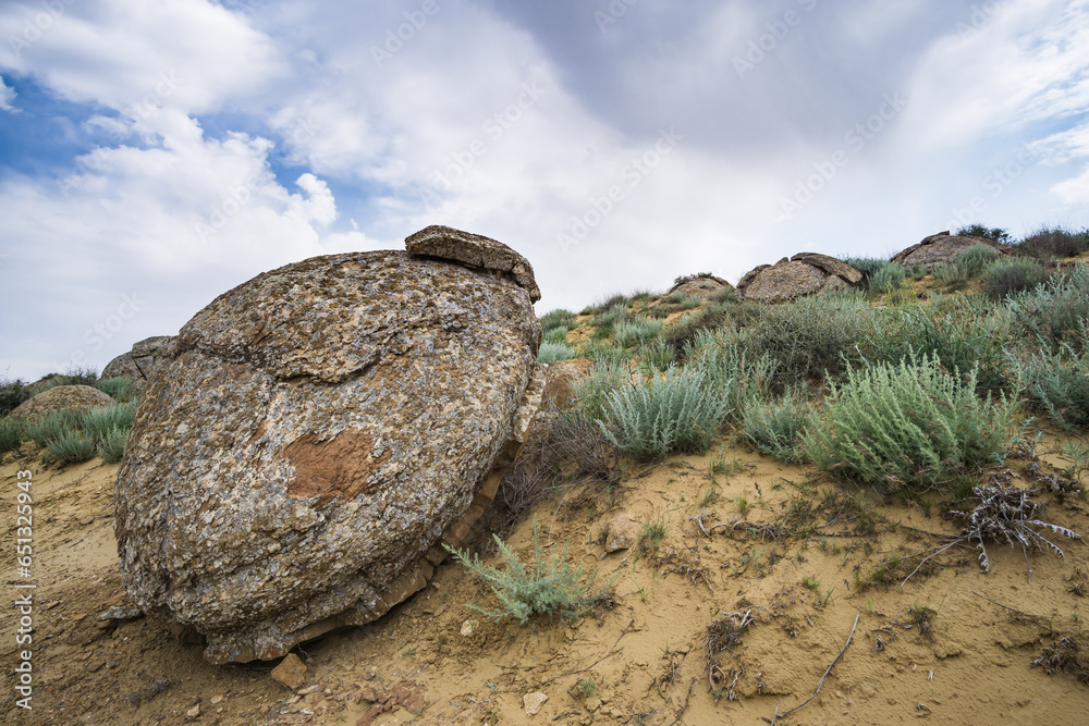 Unusual spherical shape of stones in the Kazakh steppe Mangistau, valley of balls in nature Torysh Unusual spherical shape of stones in the Kazakh steppe Mangistau, valley of balls in nature Torysh