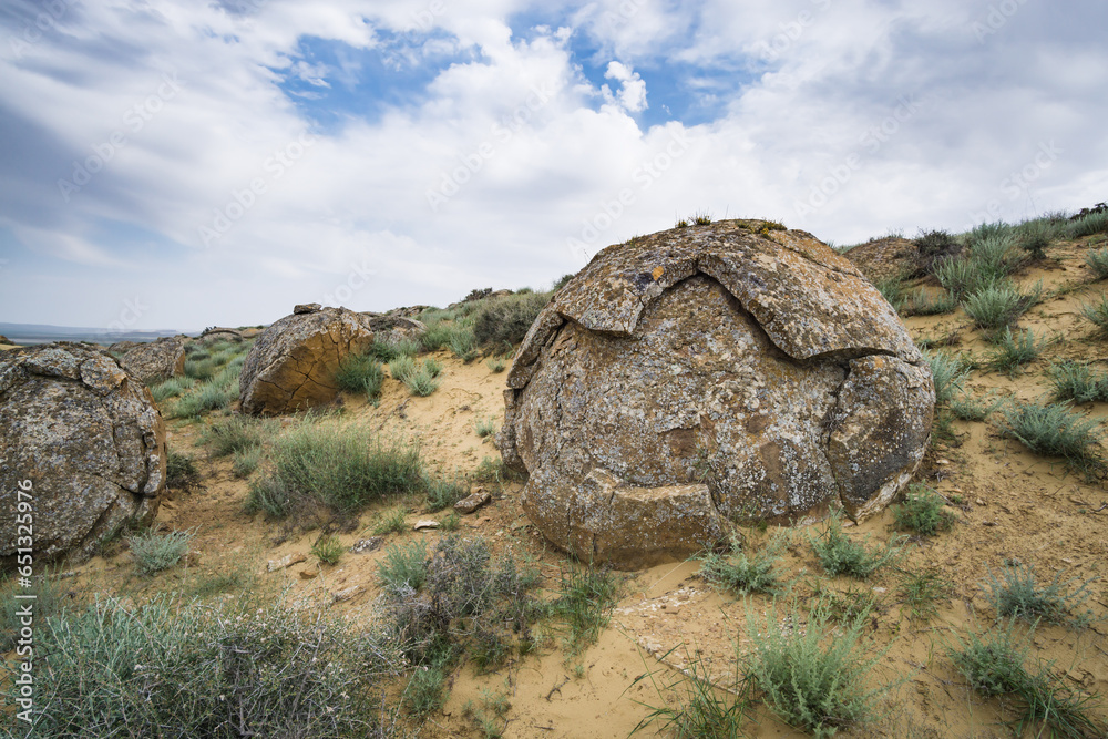 Unusual spherical shape of stones in the Kazakh steppe Mangistau, valley of balls in nature Torysh