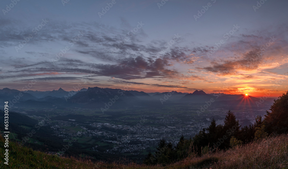 Sunset view from Gaisberg hill over Salzburg city in summer hot evening