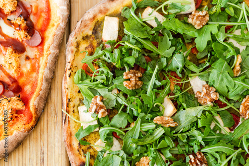 Appetizing pizza with walnut and lettuce photo