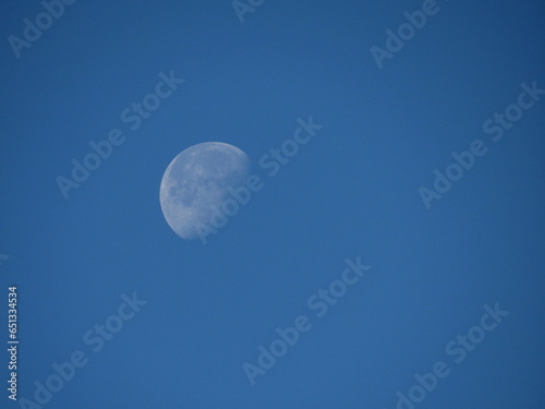 Faded moon at noon.