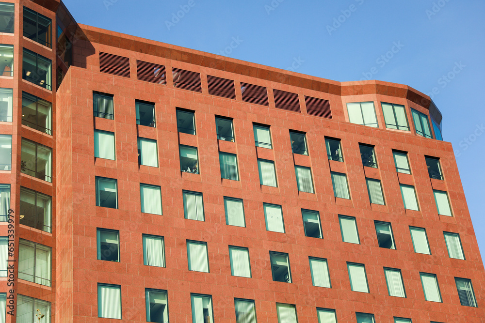 brick building in a vibrant city, symbolizing success and growth in the commercial real estate business. Modern, urban, and prosperous brick building in a vibrant city, symbolizing success and growth in the commercial real estate business. Modern, urban, and prosperous