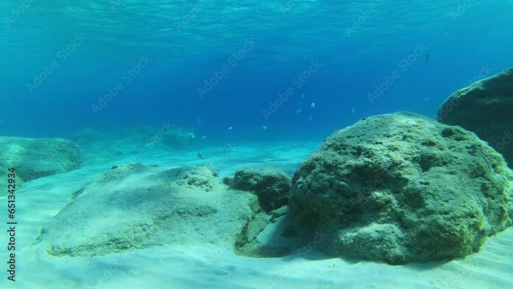Crete snorkeling tour though crystal clear water with sun from top