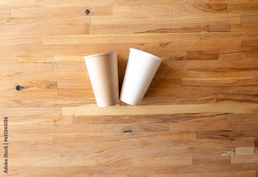 paper cup of coffee nature frindely on wooden background from top view with mock up space paper cup of coffee nature frindely on wooden background from top view with mock up space