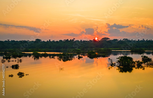 Scenic aerial sunset view of rainforest water jungle in Amazonas Brazil