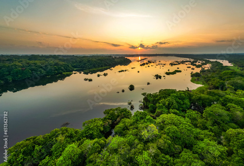 Obraz na płótnie Scenic aerial sunset view of rainforest water jungle in Amazonas Brazil w salonie