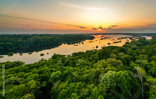 Scenic aerial sunset view of rainforest water jungle in Amazonas Brazil