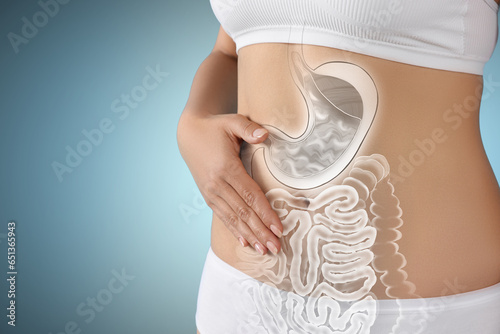 Woman with healthy digestive system on light blue background, closeup. Illustration of gastrointestinal tract photo