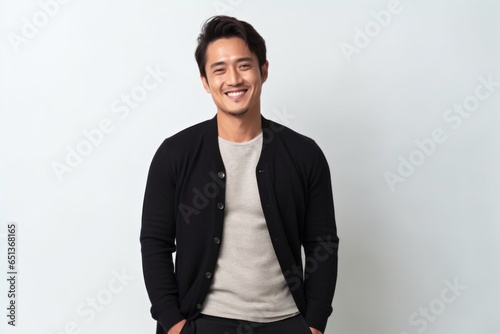 Medium shot portrait photography of a Vietnamese man in his 30s against a white background photo