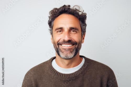 Portrait photography of a happy French man in his 40s against a white background