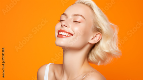 Beautiful model on an orange colored background