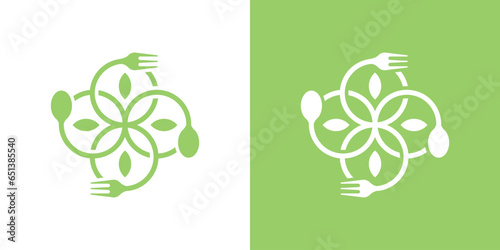 organic food logo design with spoon and fork elements combined with leaves.