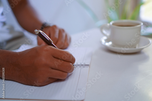 Photography Author Hand Holding Pen Write in Notebook, Writing Journal Concept