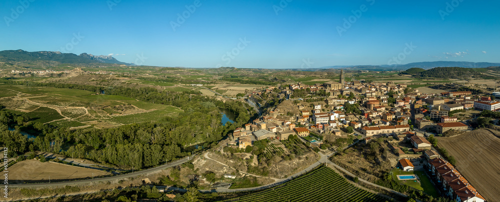 Aerial panoramic view of Briones, medieval hilltop village with Gothic church and ruined castle above the Ebro river in Rioja Spain