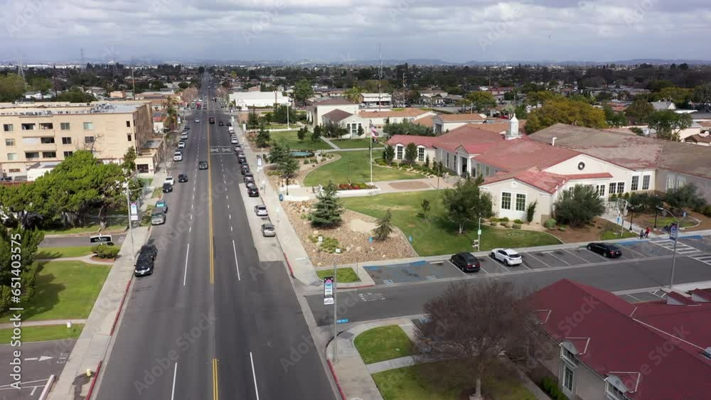 South Gate, California, USA - February 11, 2023: Traffic passes through the urban core of South Gate. South Gate, California, USA - February 11, 2023: Traffic passes through the urban core of South Gate.