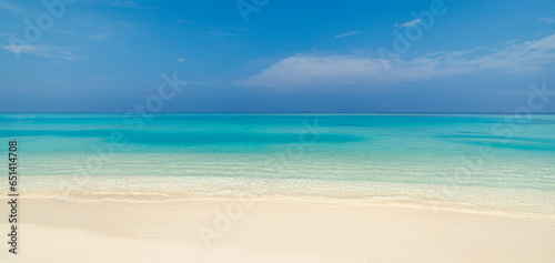 Closeup of sea waves beach blue summer sky. Panoramic beach landscape. Mediterranean sandy coast seascape. Blue sky inspire calm tranquil relaxing sunlight. Travel destination  popular vacation banner