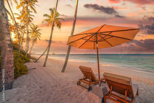 Romantic tropical island  couple chairs umbrella under palm tree leaves  paradise sea sand sky. Summer travel landscape amazing vacation beach. Exotic honeymoon closeup of leisure recreation relax