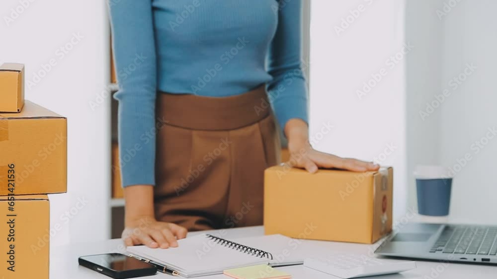 Business woman start up small business entrepreneur SME success .freelance woman working at home with Online Parcel delivery. SME and packaging deliveryconcept Business woman start up small business entrepreneur SME success .freelance woman working at home with Online Parcel delivery. SME and packaging deliveryconcept
