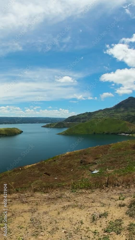 A beautiful lake among mountains and volcanoes. Lake Toba and Samosir Island. Sumatra, Indonesia. A beautiful lake among mountains and volcanoes. Lake Toba and Samosir Island. Sumatra, Indonesia.