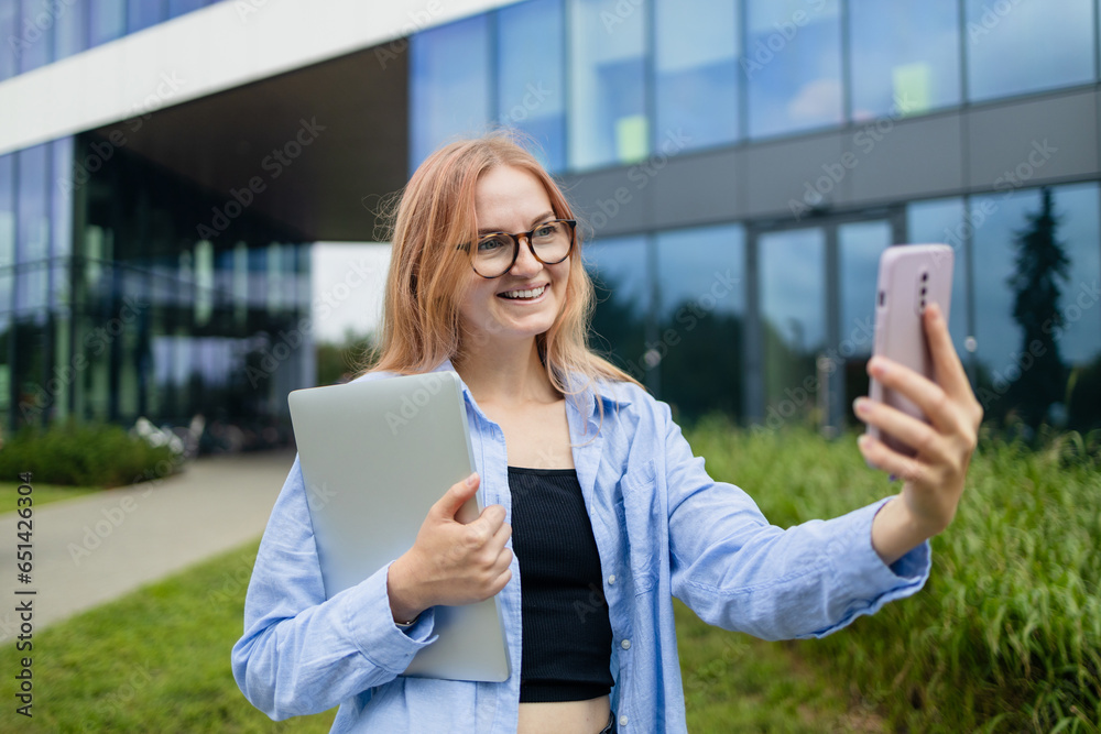 Happy business woman holding a digital tablet reading a text message on her phone while commuting to work in the city. High quality photo Happy business woman holding a digital tablet reading a text message on her phone while commuting to work in the city. High quality photo