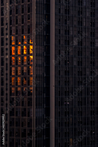 dark orange sunset reflected in high-rise building windows