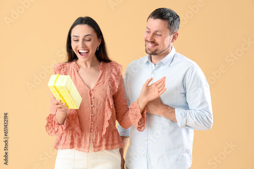 Happy young couple with gif...
