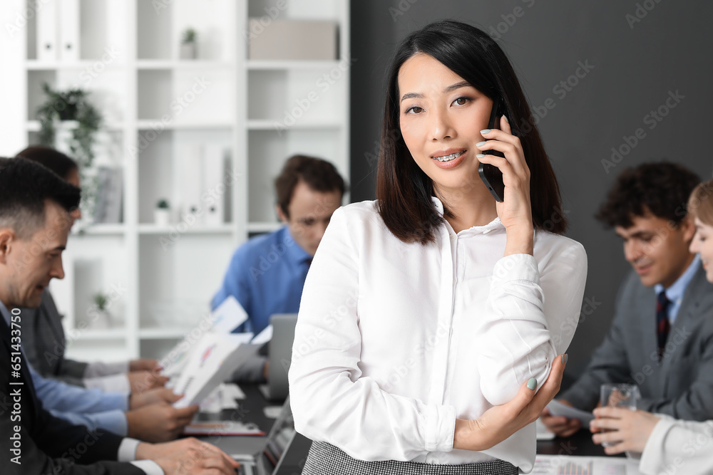 Female Asian business consultant working in office Female Asian business consultant working in office