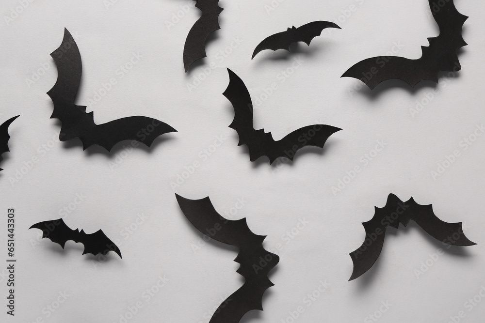 Fototapeta premium Paper bats for Halloween party on grey background