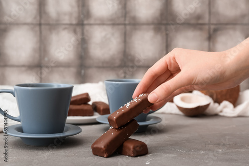 Woman eating tasty chocolat...