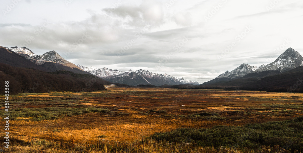 valley between snowy mountain range