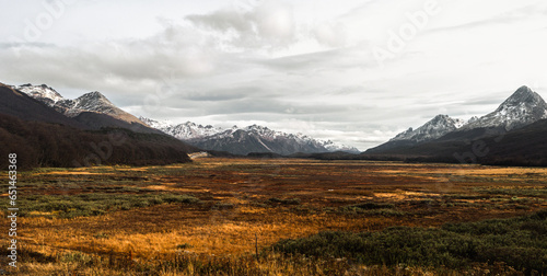 valley between snowy mountain range