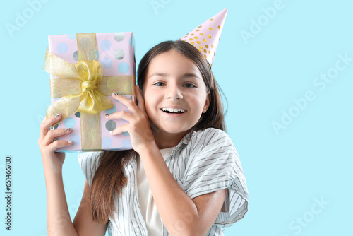 Happy little girl with Birt...