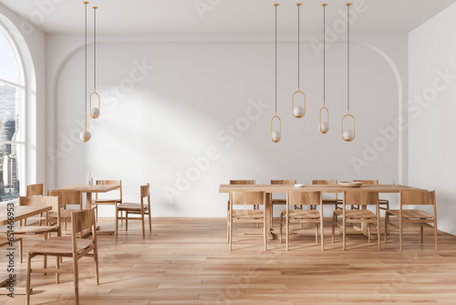 Stylish cafeteria interior with chairs and table near window, eating space