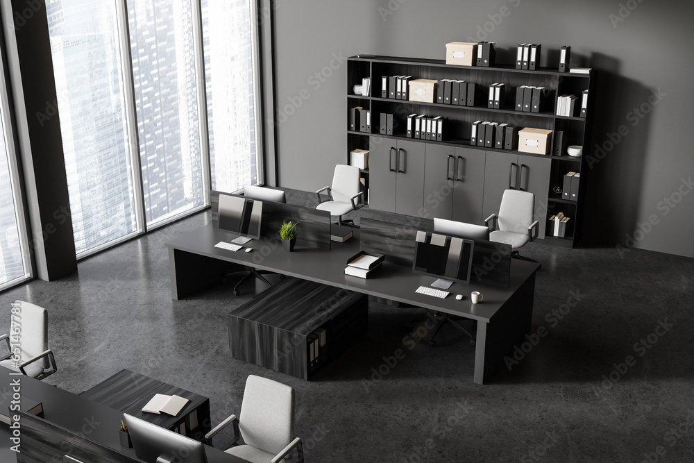 Top view of coworking interior with pc monitors and shelf, panoramic window Top view of coworking interior with pc monitors and shelf, panoramic window
