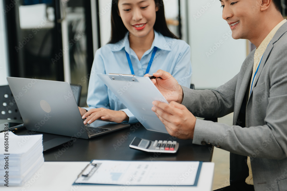 Business team meeting,work process.professional crew working with new startup project.Project managers. business plans, Laptop smartphone hands. Business team meeting,work process.professional crew working with new startup project.Project managers. business plans, Laptop smartphone hands.