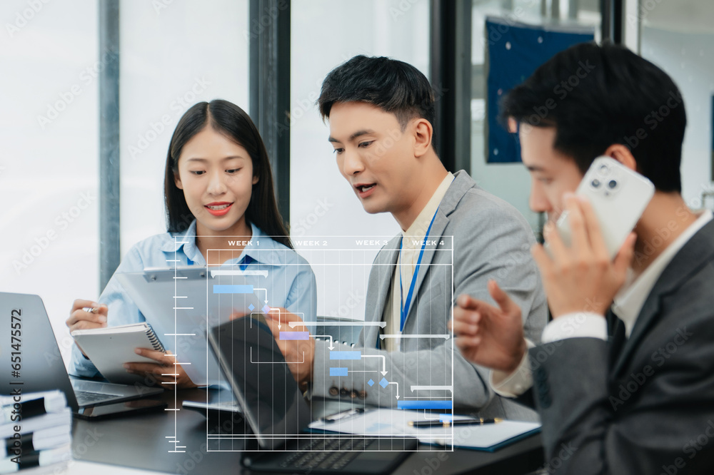 Project manager working and update tasks with milestones progress planning and Gantt chart scheduling diagram.business tram working at office. Project manager working and update tasks with milestones progress planning and Gantt chart scheduling diagram.business tram working at office.