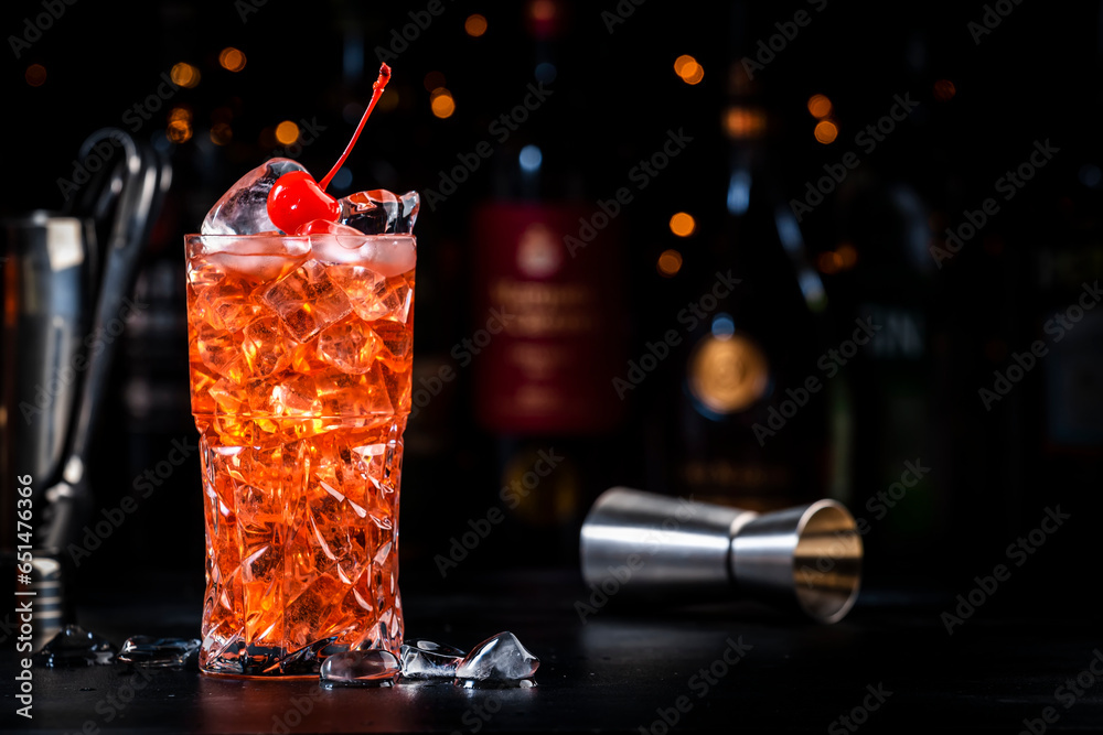 Rose with cherry, red cocktail drink with pink vermouth, amaretto