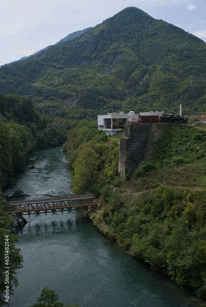 Jablanica, Bosnia and Herzegovina - Sep 18, 2023: Old Neretva Train Bridge. Memorial of the Battle on the Neretva, fought between Yugoslav partisans and Axis forces. Sunny summer day. Selective focus.
