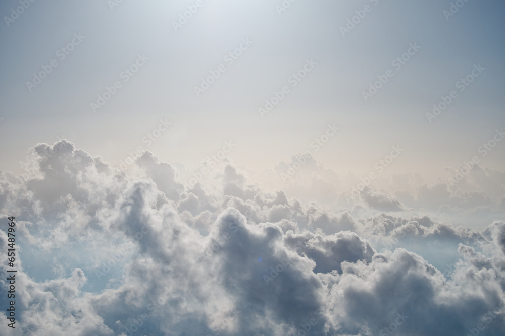 High angle view of white fluffy clouds at sunset time, viewed from summit of Emei mountains, the sea of clouds. High angle view of white fluffy clouds at sunset time, viewed from summit of Emei mountains, the sea of clouds.