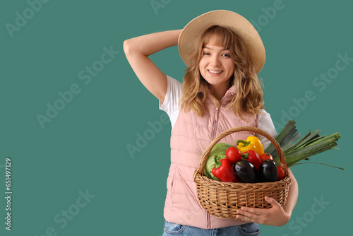 Happy young female farmer w...