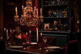 Dark and Moody Interiors: A dining room, deep plum walls and dark wood furniture. Antique silver candle holders adorn the table. An opulent chandelier, dimmed