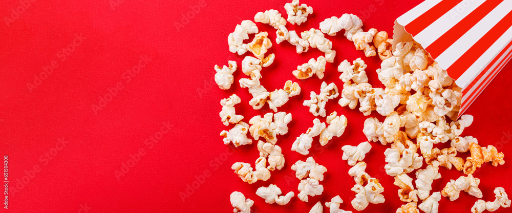 cardboard box with popcorn on a red background