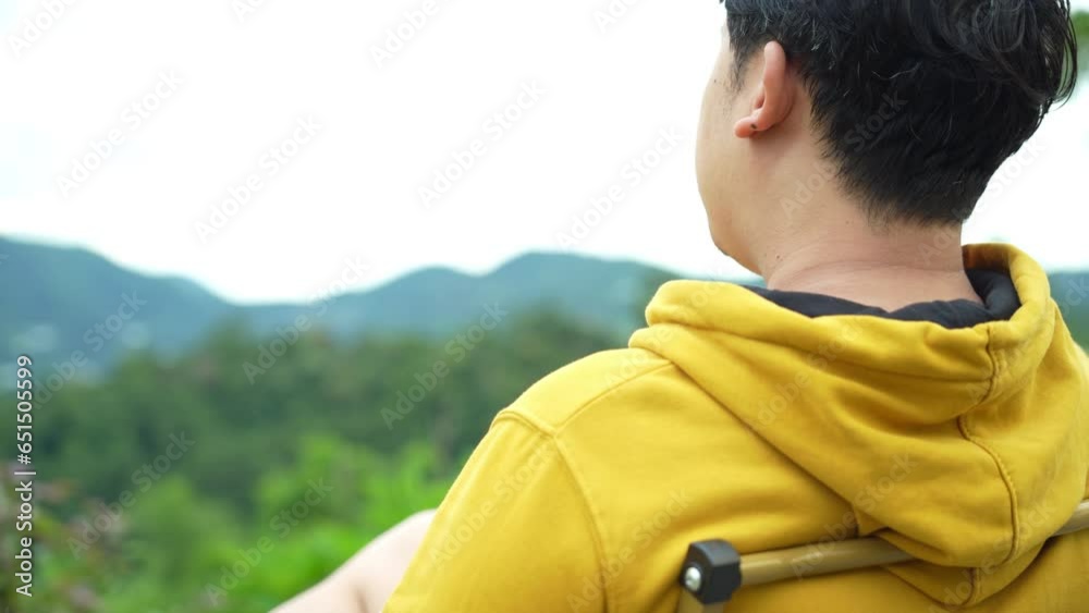 Asian Man camping during camping in forest. Asian Man camping during camping in forest.