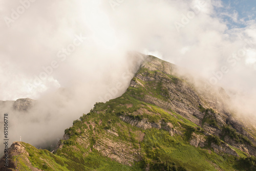 Thick clouds over the mountains on a sunny summer day