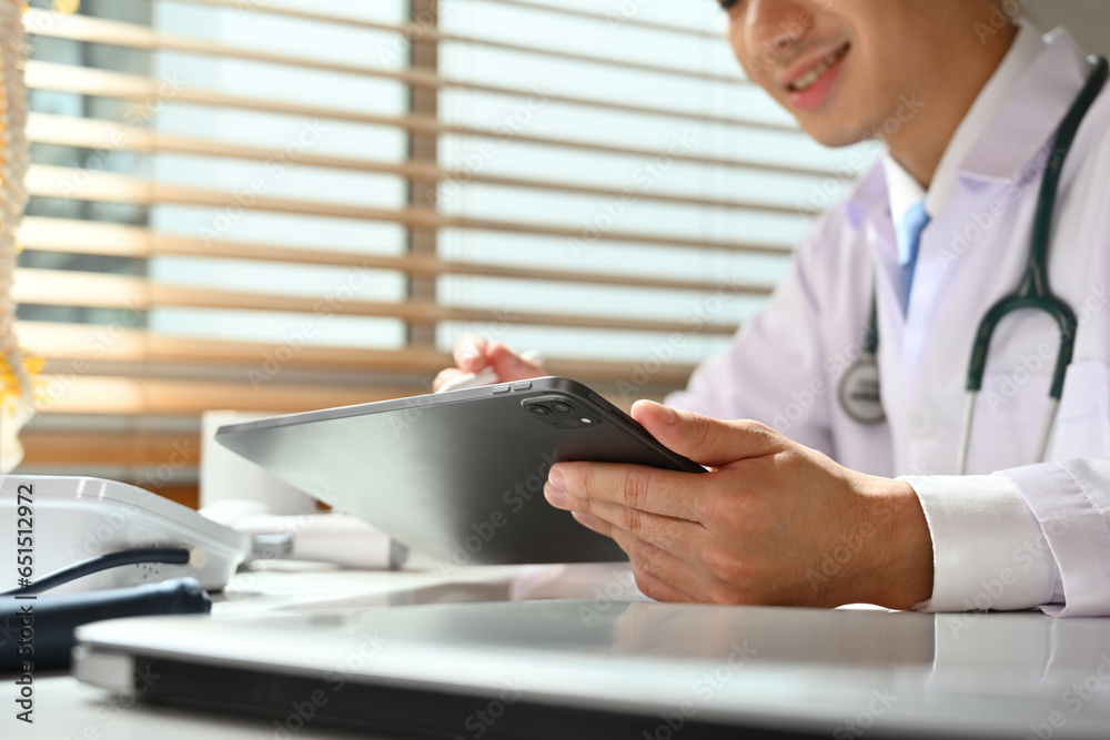 Fototapeta premium Close-up image of doctor using a digital tablet