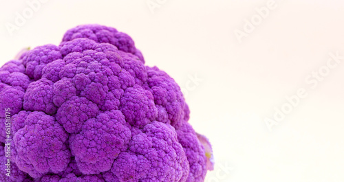 Purple cauliflower on yellow background.