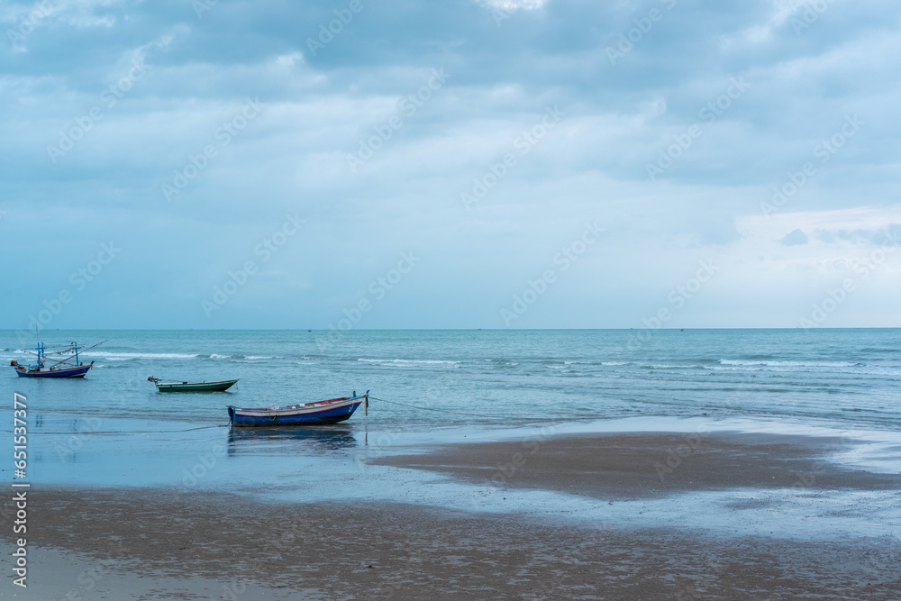 Fisherman's boats moored nearby on the beach,and beautiful clouds