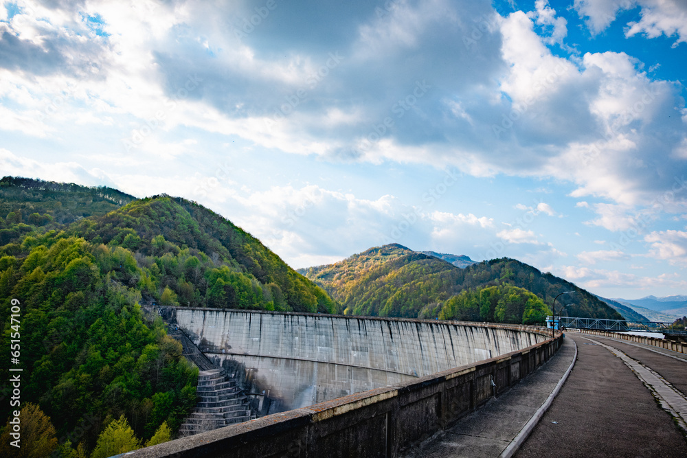 Dam in a mountain forest at sunset Dam in a mountain forest at sunset