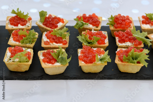 Tartlets with red caviar. Appetizers are delicious for a buffet.